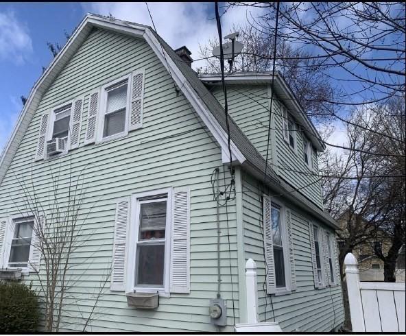 13 Furrow St, Westfield, MA 01085 - view of side of property featuring a gambrel roof and a chimney