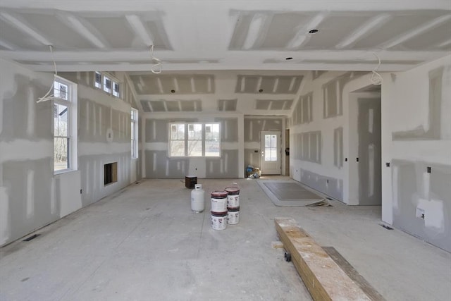 unfurnished living room featuring visible vents