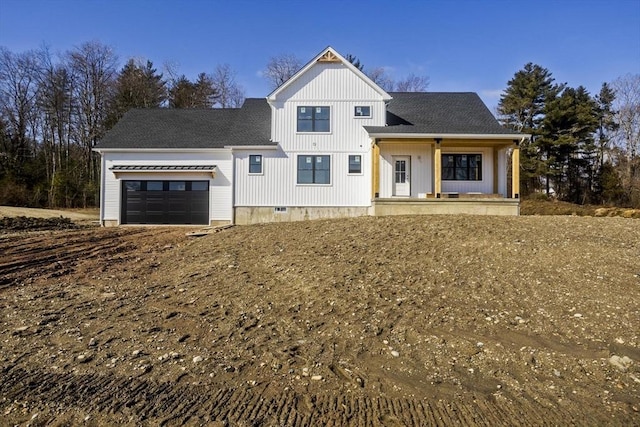 modern farmhouse style home featuring a shingled roof, an attached garage, and crawl space