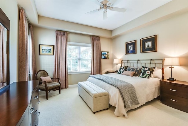 bedroom featuring light carpet and ceiling fan