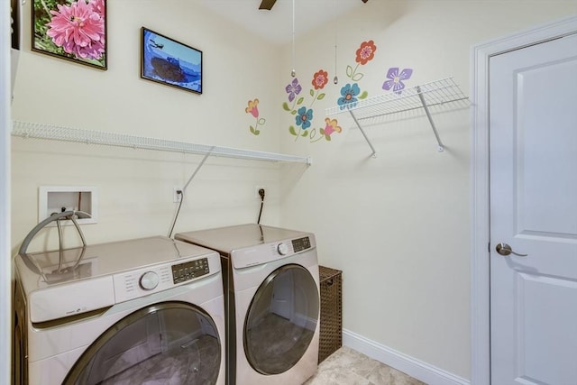 laundry room with washer and clothes dryer, laundry area, a ceiling fan, and baseboards