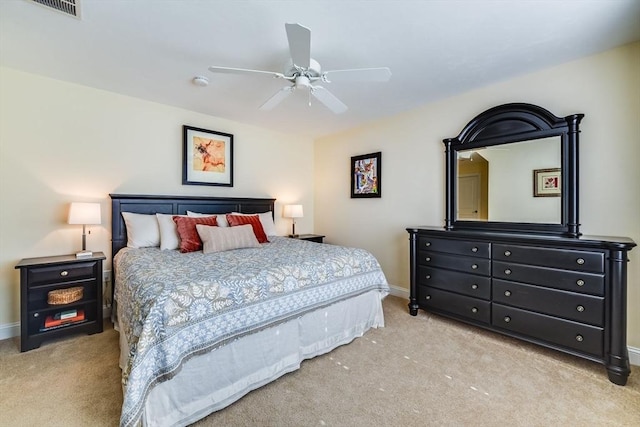 bedroom featuring carpet flooring, visible vents, baseboards, and ceiling fan