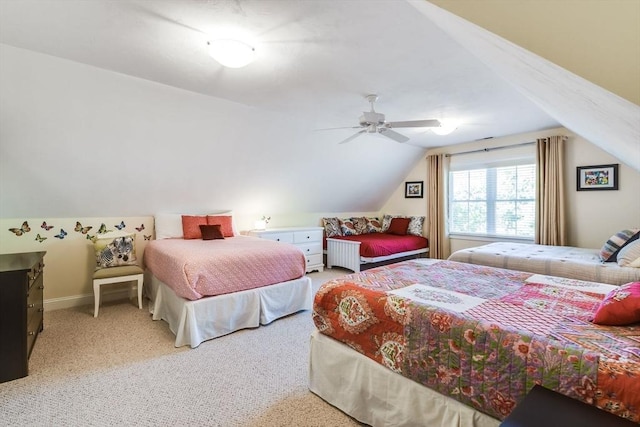 bedroom featuring light carpet, ceiling fan, baseboards, and lofted ceiling