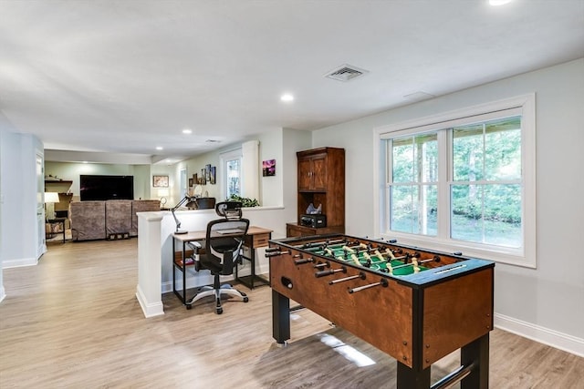 recreation room featuring recessed lighting, baseboards, visible vents, and light wood-type flooring