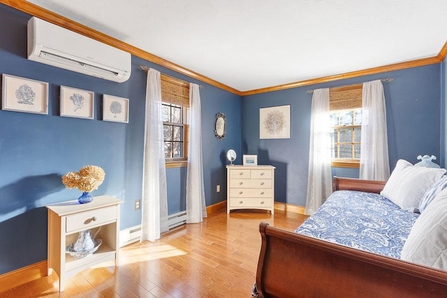 bedroom with ornamental molding, wood finished floors, a wall mounted air conditioner, and multiple windows