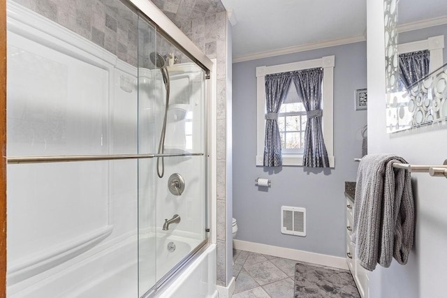 bathroom featuring baseboards, toilet, enclosed tub / shower combo, tile patterned floors, and crown molding