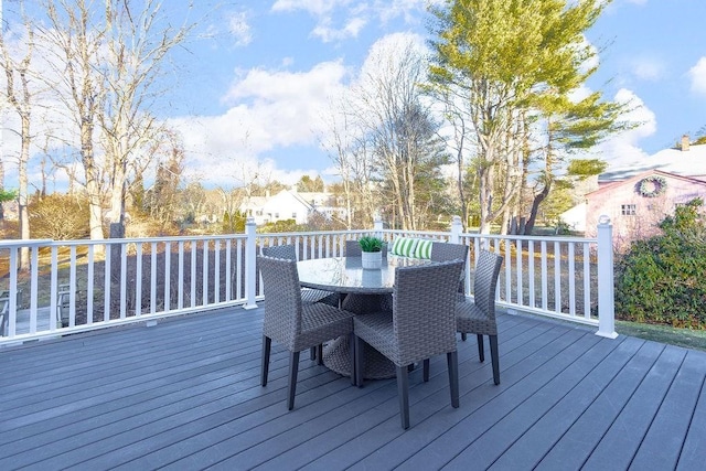 wooden deck featuring outdoor dining area