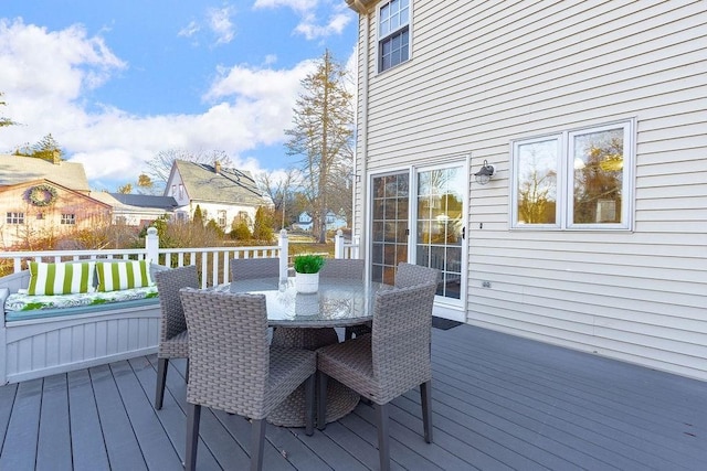 wooden terrace featuring outdoor dining space