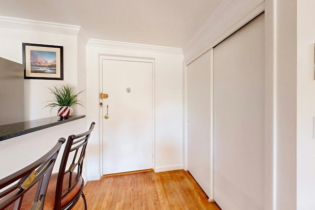 95 Maple St Unit 21, Malden, MA 02148 - doorway with light wood finished floors and ornamental molding