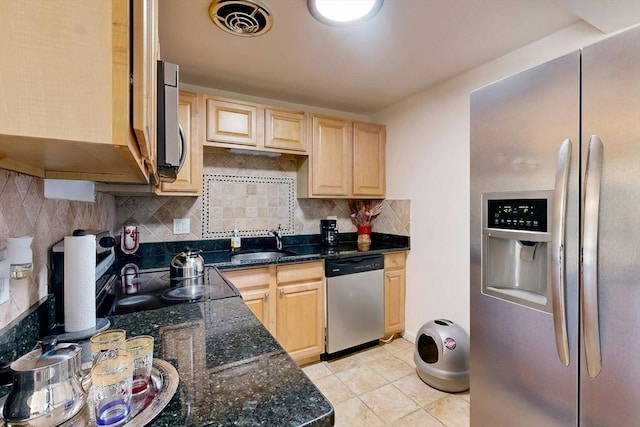 95 Maple St Unit 21, Malden, MA 02148 - kitchen with a sink, decorative backsplash, light brown cabinetry, light tile patterned floors, and appliances with stainless steel finishes