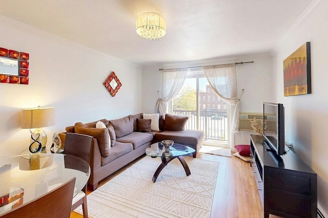 95 Maple St Unit 21, Malden, MA 02148 - living room with crown molding, a baseboard heating unit, a chandelier, and wood finished floors