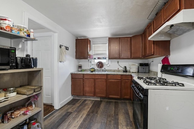 kitchen with gas range and dark wood-type flooring