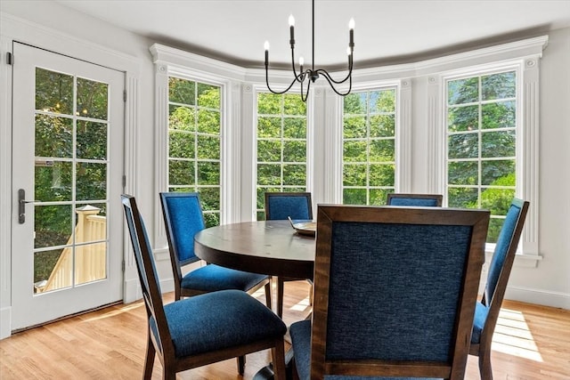 11 Ashford Ln, Andover, MA 01810 - dining room with a chandelier, healthy amount of natural light, and light wood-type flooring