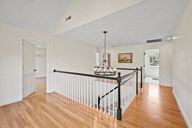 11 Ashford Ln, Andover, MA 01810 - hall with a chandelier, light wood finished floors, an upstairs landing, lofted ceiling, and recessed lighting