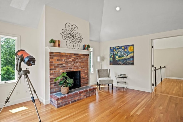 11 Ashford Ln, Andover, MA 01810 - sitting room featuring vaulted ceiling, wood finished floors, a fireplace, and recessed lighting