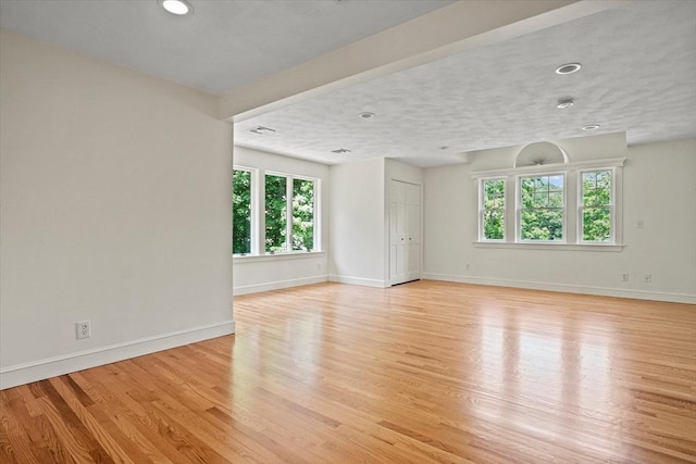 11 Ashford Ln, Andover, MA 01810 - empty room with healthy amount of natural light, light wood-style floors, and recessed lighting