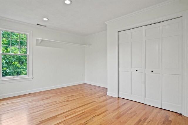 11 Ashford Ln, Andover, MA 01810 - unfurnished bedroom with crown molding, light wood-style floors, a closet, and recessed lighting