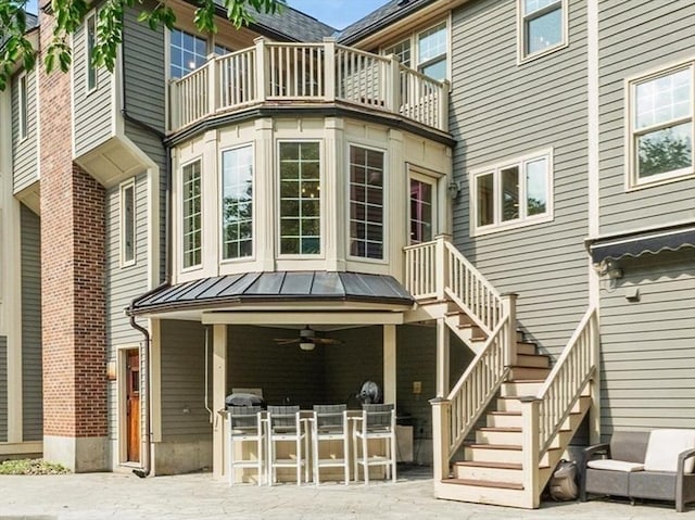 11 Ashford Ln, Andover, MA 01810 - rear view of house featuring a ceiling fan, a patio area, a balcony, a standing seam roof, and stairs