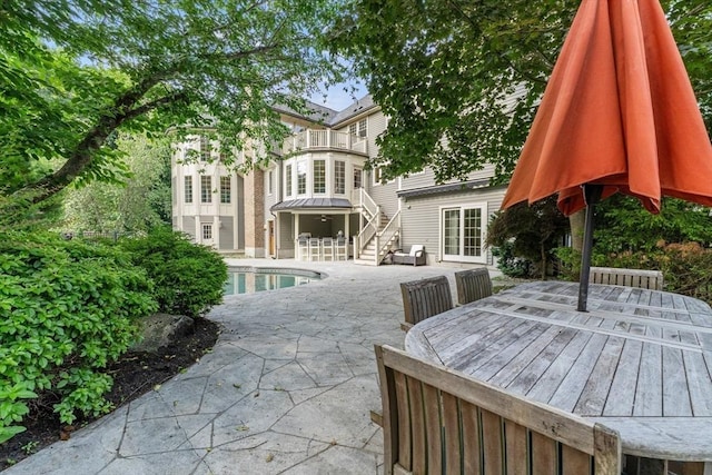11 Ashford Ln, Andover, MA 01810 - rear view of property with a balcony, an outdoor pool, a patio, and outdoor dining area