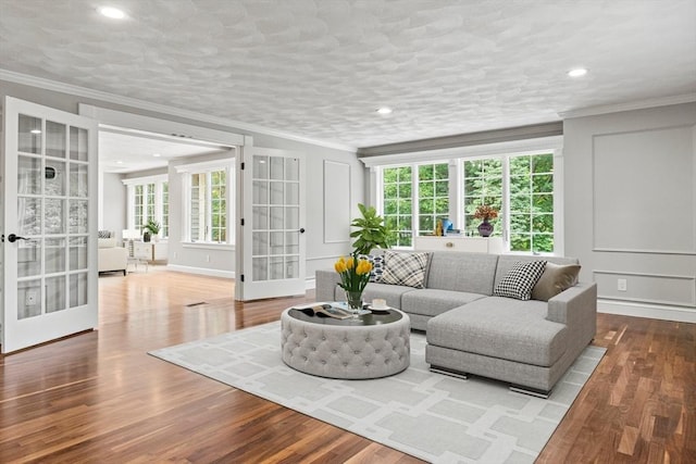 11 Ashford Ln, Andover, MA 01810 - living room featuring crown molding, healthy amount of natural light, wood finished floors, recessed lighting, and french doors
