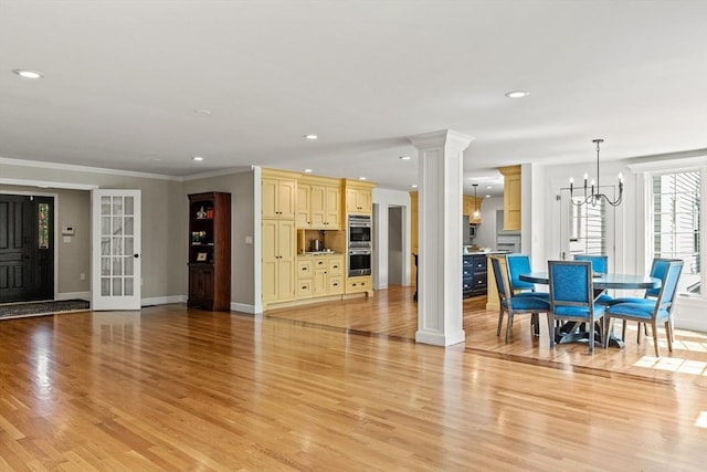 11 Ashford Ln, Andover, MA 01810 - living room featuring decorative columns, light wood-type flooring, recessed lighting, a chandelier, and ornamental molding