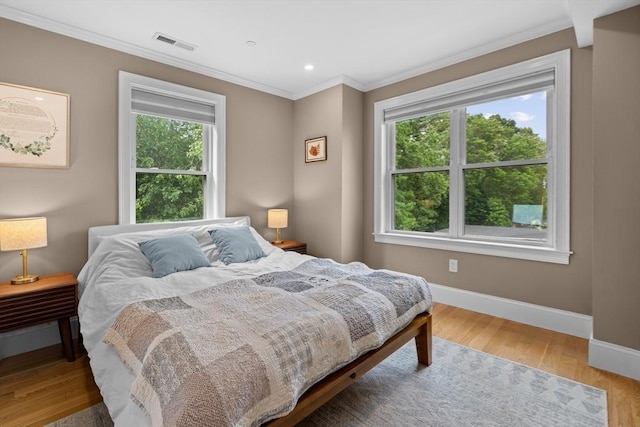 34 Colgate Rd Unit 3, Boston, MA 02131 - bedroom with multiple windows, baseboards, crown molding, wood finished floors, and recessed lighting