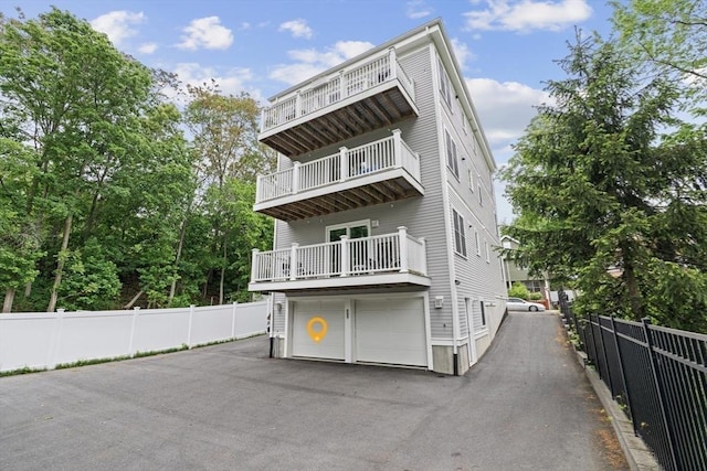 34 Colgate Rd Unit 3, Boston, MA 02131 - view of front of home featuring a balcony, driveway, and an attached garage