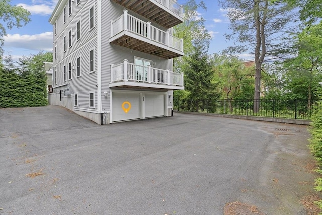 34 Colgate Rd Unit 3, Boston, MA 02131 - view of home's exterior with a balcony, driveway, and an attached garage