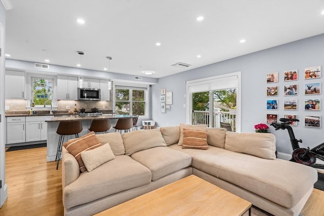 34 Colgate Rd Unit 3, Boston, MA 02131 - living room featuring light wood finished floors, healthy amount of natural light, and recessed lighting