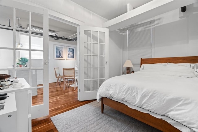 bedroom with wood finished floors