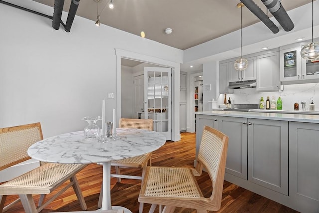 kitchen with gray cabinets, light wood-style floors, and light countertops