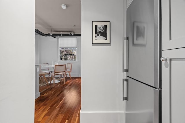 hall with hardwood / wood-style floors