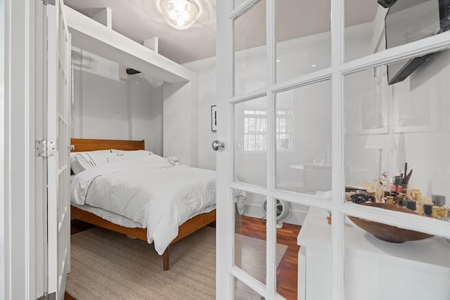 bedroom with wood finished floors