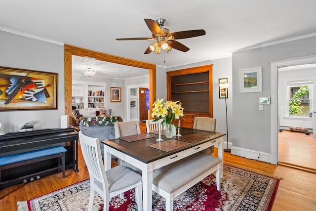 466 Lincoln St, Marlborough, MA 01752 - dining space with ornamental molding, ceiling fan, wood finished floors, a chandelier, and baseboards