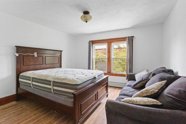 466 Lincoln St, Marlborough, MA 01752 - bedroom featuring light wood-style flooring, a baseboard heating unit, and baseboards
