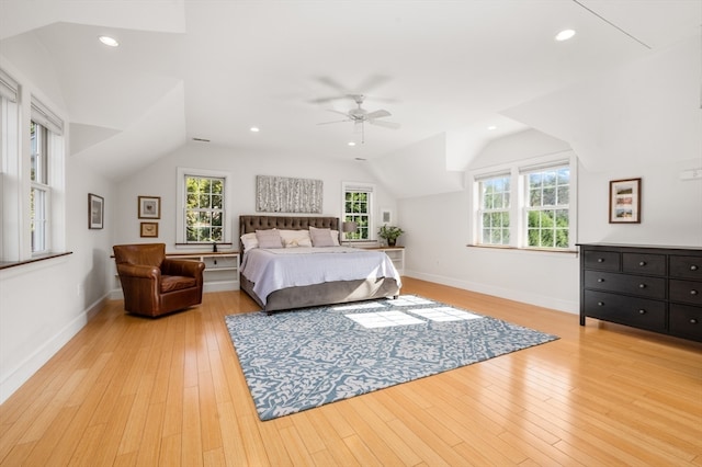 bedroom featuring vaulted ceiling, light wood-type flooring, and ceiling fan