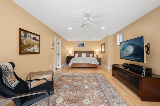 bedroom with light hardwood / wood-style floors and ceiling fan