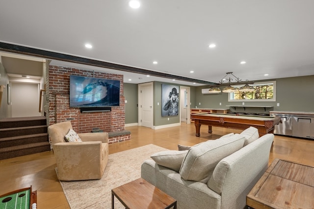 living room with light hardwood / wood-style floors and billiards