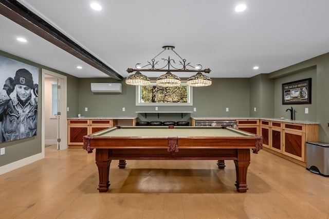 playroom with a wall mounted AC, light hardwood / wood-style flooring, and pool table