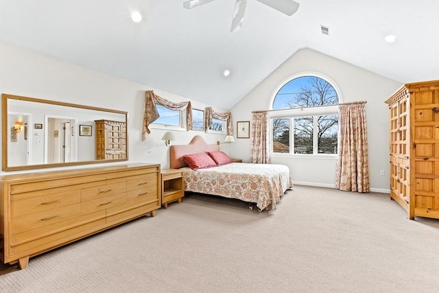 bedroom with vaulted ceiling, light colored carpet, and ceiling fan