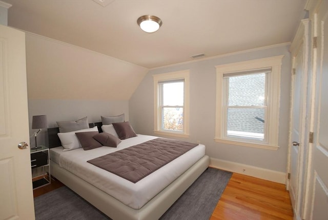 20 Beechwood Ave Unit B, Watertown, MA 02472 - bedroom with wood finished floors, baseboards, lofted ceiling, and ornamental molding