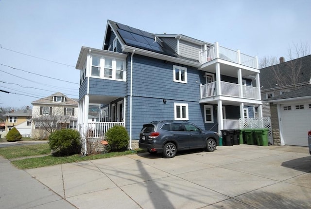20 Beechwood Ave Unit B, Watertown, MA 02472 - view of front of home with solar panels and driveway