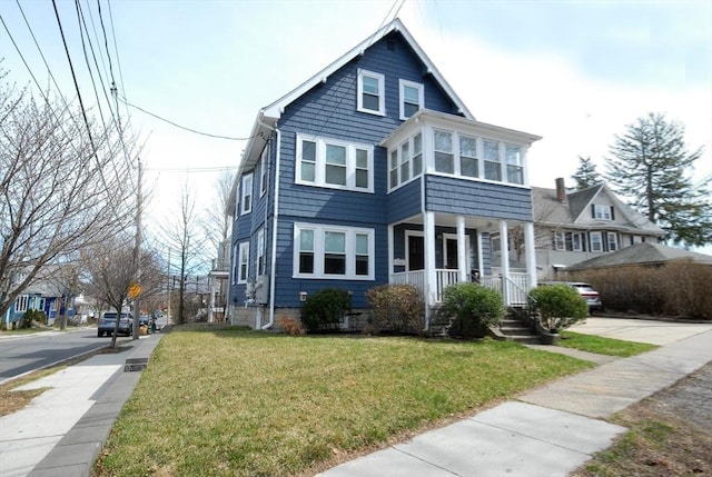 20 Beechwood Ave Unit B, Watertown, MA 02472 - view of front of property featuring covered porch and a front lawn