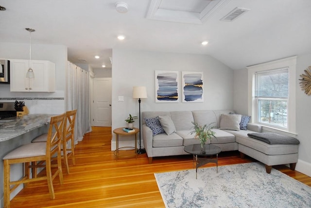 20 Beechwood Ave Unit B, Watertown, MA 02472 - living room with light wood finished floors, recessed lighting, and lofted ceiling