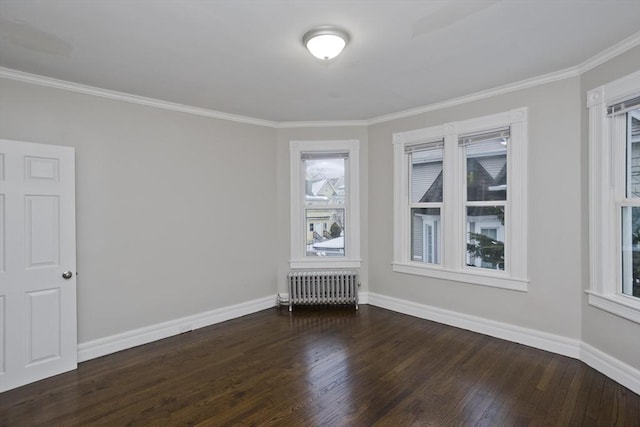 unfurnished room featuring radiator heating unit, crown molding, and dark wood-type flooring