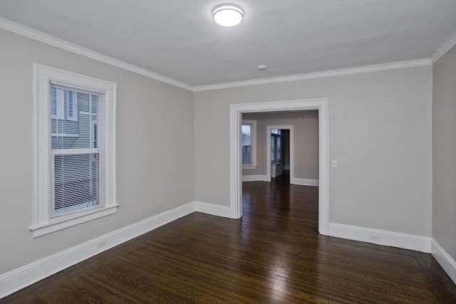 unfurnished room with dark wood-type flooring and crown molding