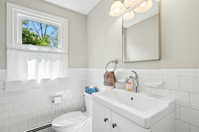 30 Eastview Rd, Hopkinton, MA 01748 - bathroom featuring tile walls, baseboard heating, vanity, and a wainscoted wall