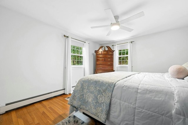 30 Eastview Rd, Hopkinton, MA 01748 - bedroom featuring baseboard heating, wood finished floors, and ceiling fan