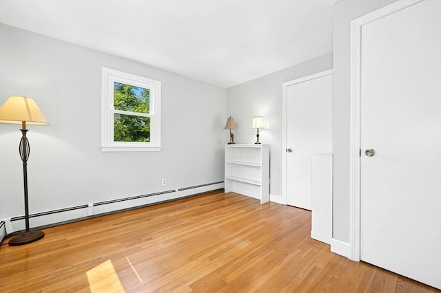 30 Eastview Rd, Hopkinton, MA 01748 - unfurnished bedroom featuring wood finished floors and a baseboard radiator