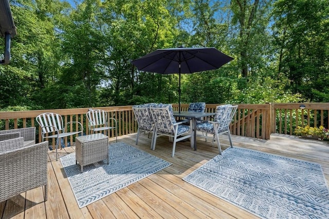 30 Eastview Rd, Hopkinton, MA 01748 - wooden deck with outdoor dining space and view of wooded area